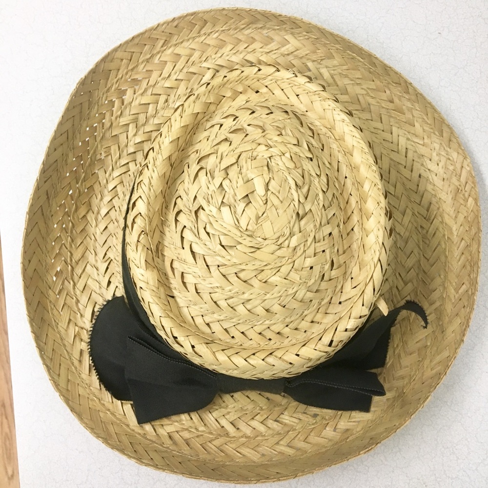 straw hat with a black bow